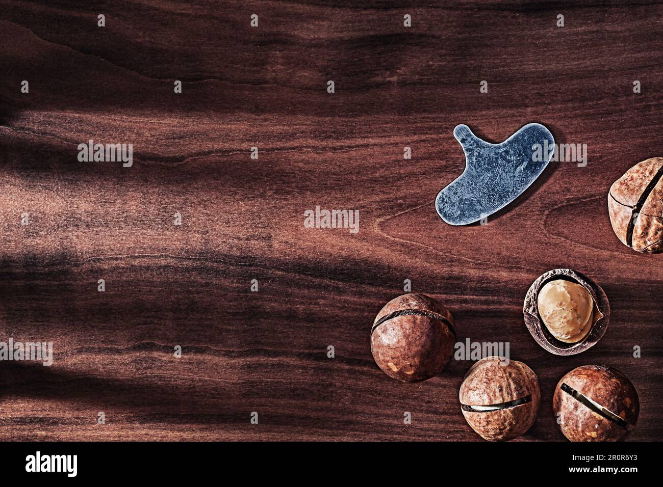 Nuts Of Macadamia On Vintage Wood With Copy Space Stock Photo