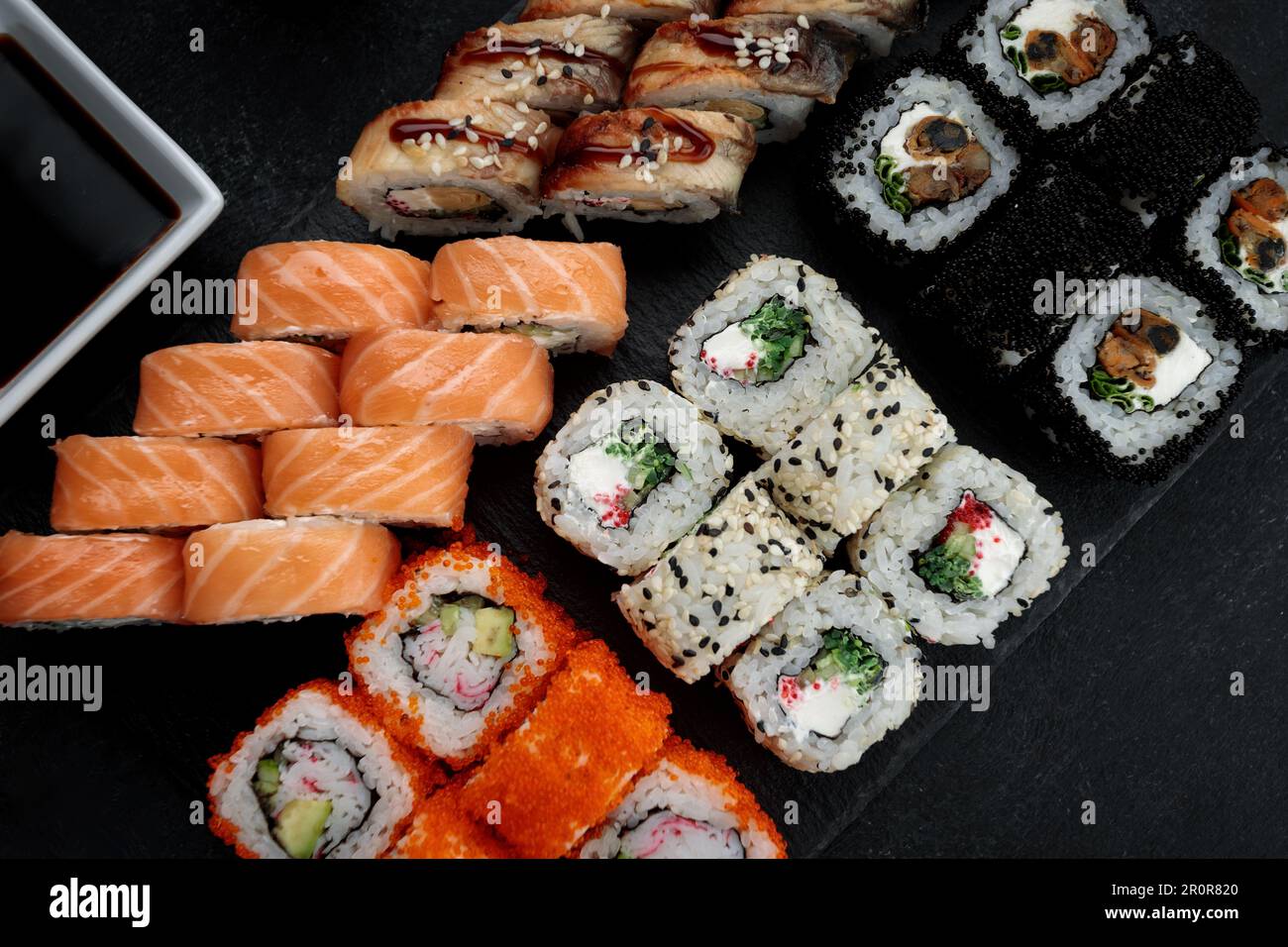 Delectable sushi set with a range of rolls and sauces Stock Photo