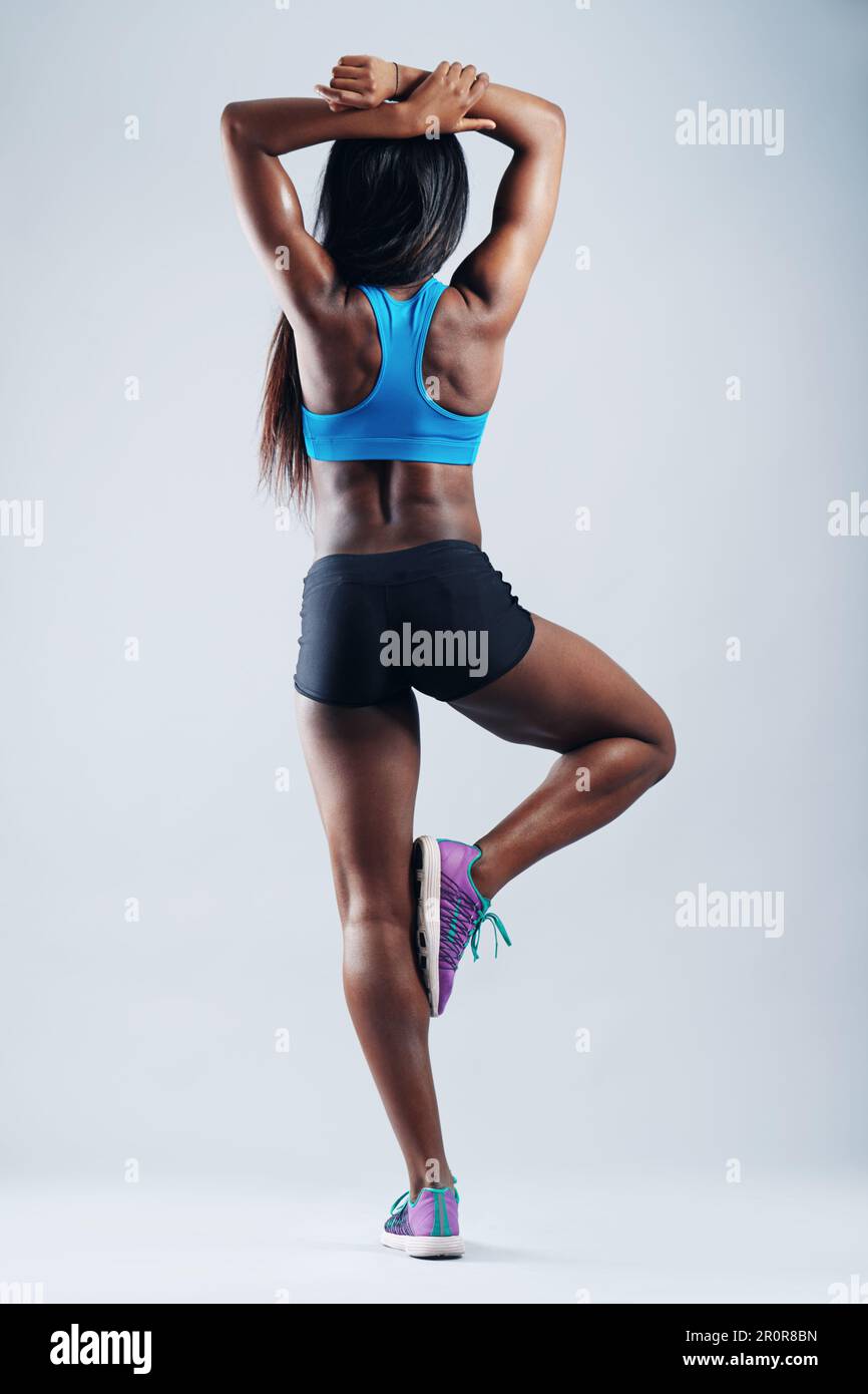 Black woman, strong muscle and body with back in studio for