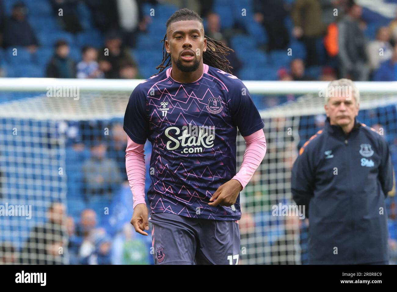 Alex Iwobi warms up for Everton FC before their match against Brighton & Hove Albion at the AMEX Stadium Stock Photo