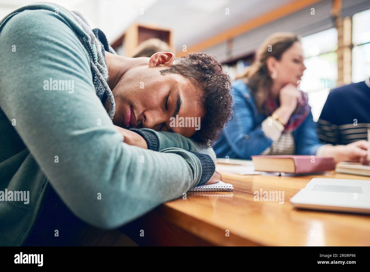 Campus Library Napping I just need a power nap. a university student falling asleep in the ...