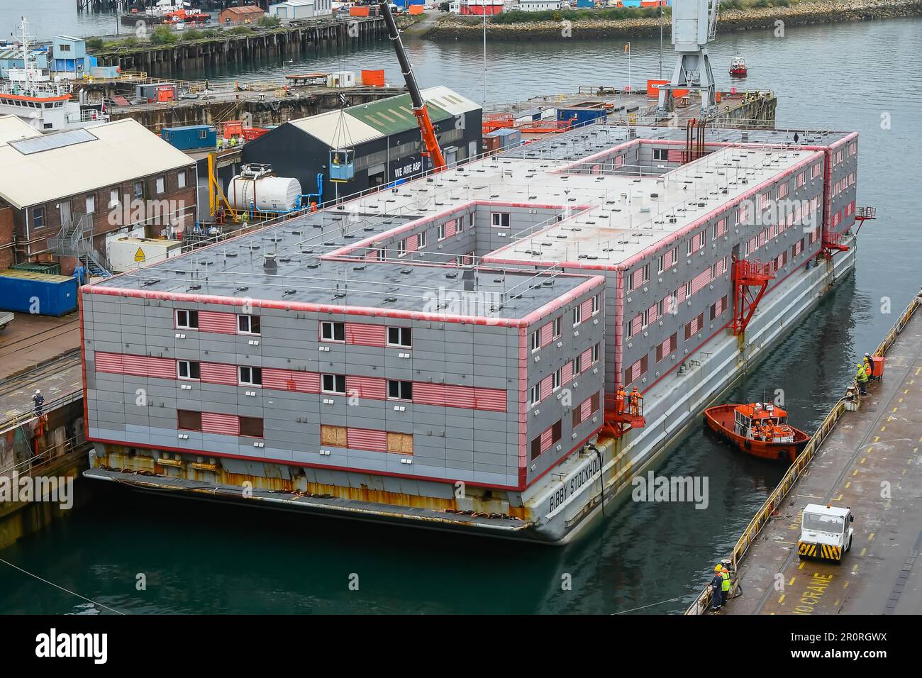 Falmouth, Cornwall, UK.  9th May 2023.  The accommodation barge Bibby Stockholm which has been towed by the tug Sea Dream, arrives at Falmouth in Cornwall from Genoa in Italy for maintenance and a safety inspections in the dry dock before being moved to Portland Port near Weymouth in Dorset in June where it will house up to 500 asylum seekers for 18 months.  Picture Credit: Graham Hunt/Alamy Live News Stock Photo