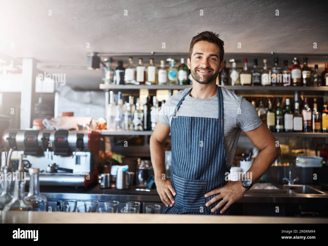 Working Bar You like it, Ill make it. Portrait of a confident young man working ...