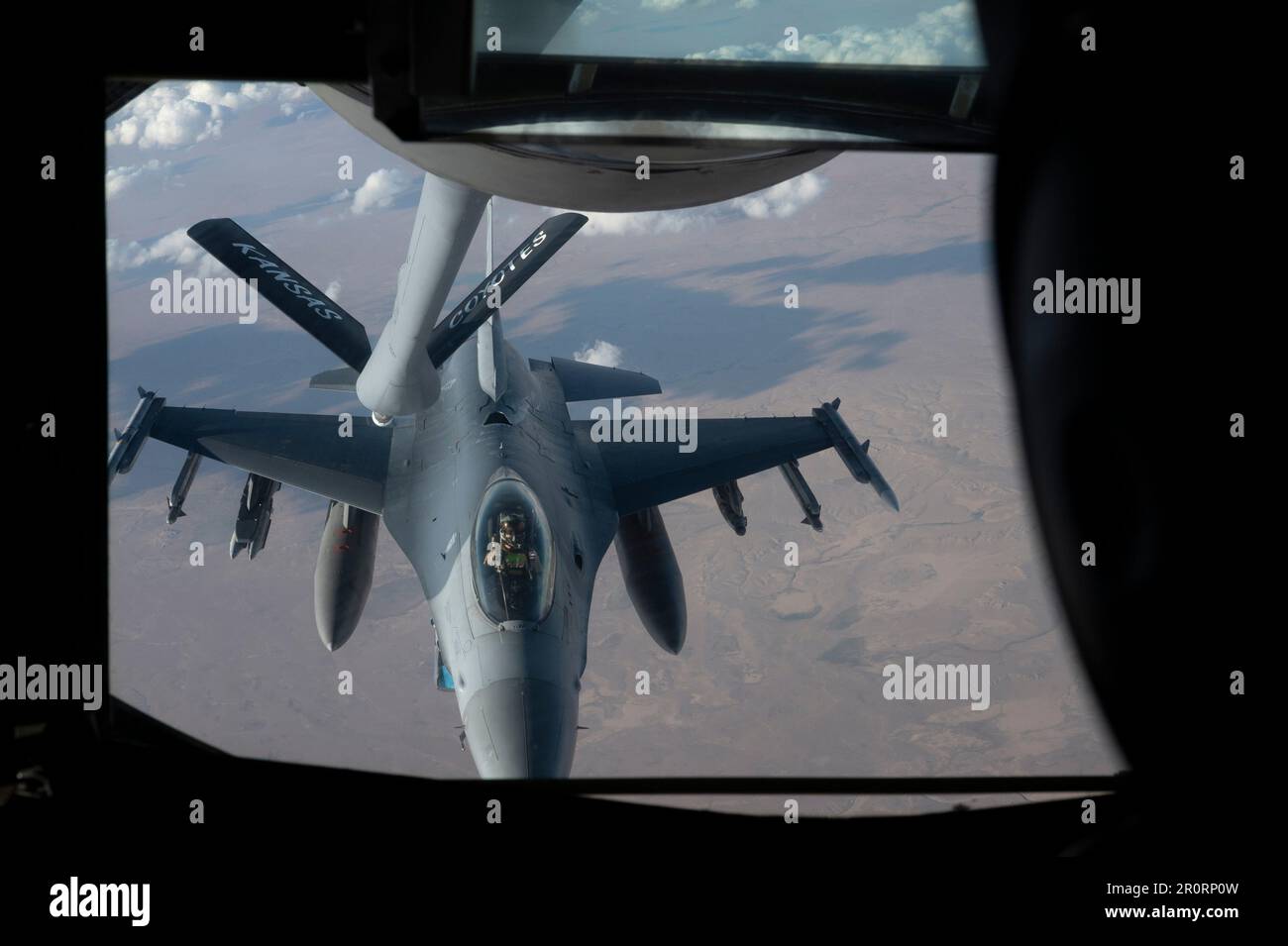 A U.S. Air Force F-16 Fighting Falcon prepares to receive fuel from a KC-135 Stratotanker within the U.S. Central Command area of responsibility, May 1, 2023. F-16 aircraft are deployed to the USCENTCOM AOR to deter adversaries, provide combat airpower and ensure regional security. (U.S. Air Force photo by Senior Airman Jacob Cabanero) Stock Photo
