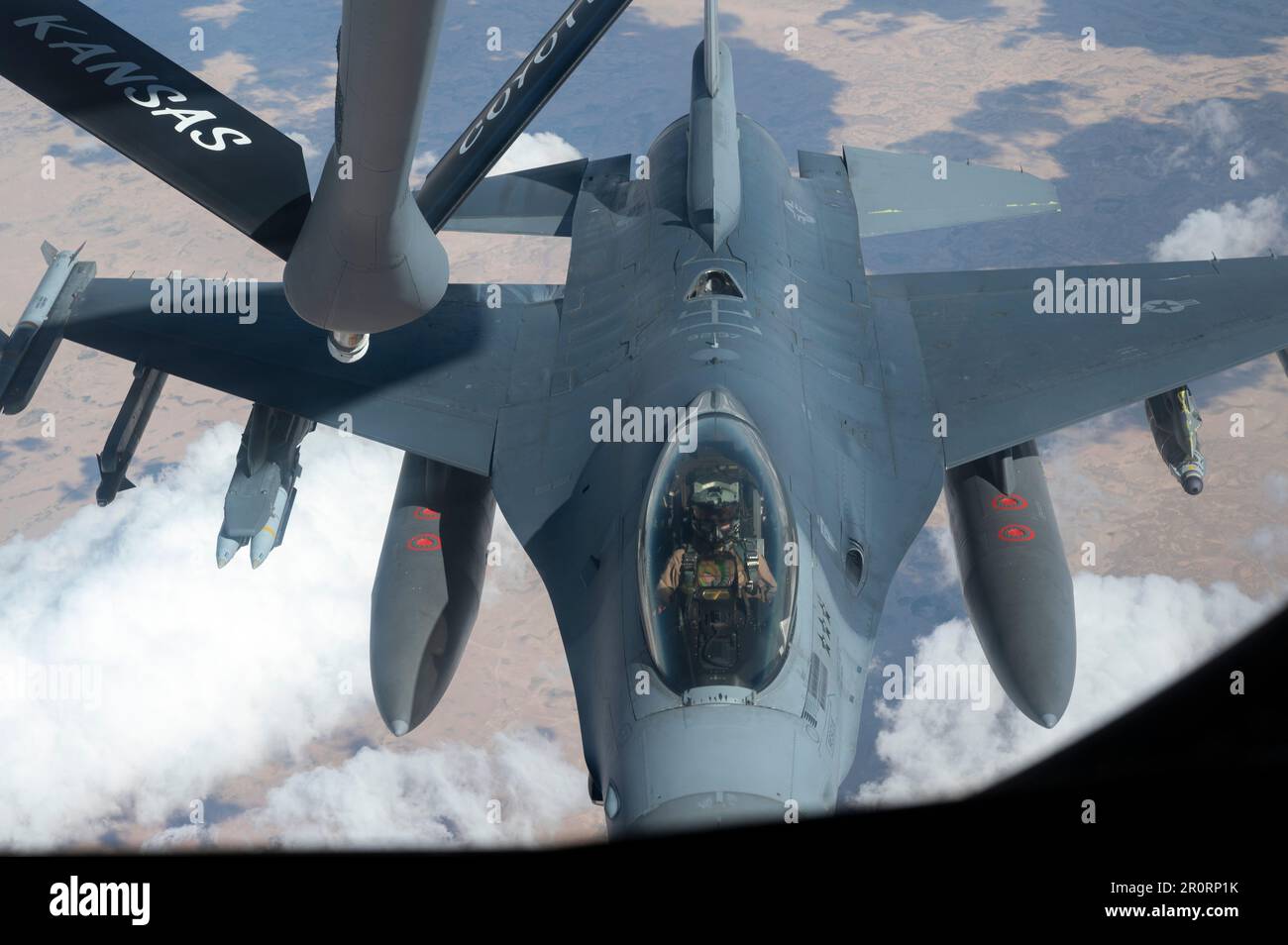 A U.S. Air Force F-16 Fighting Falcon prepares to receive fuel from a KC-135 Stratotanker above the U.S. Central Command area of responsibility, May 1, 2023. F-16 aircraft are deployed to the USCENTCOM AOR to deter adversaries, provide combat airpower and ensure regional security. (U.S. Air Force photo by Senior Airman Jacob Cabanero) Stock Photo
