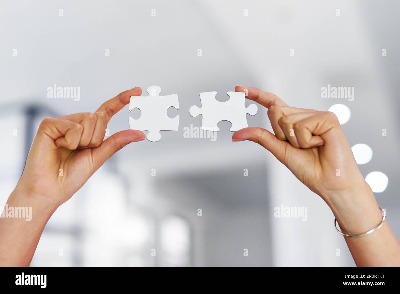 Putting it all together. an unrecognizable businesswoman holding two