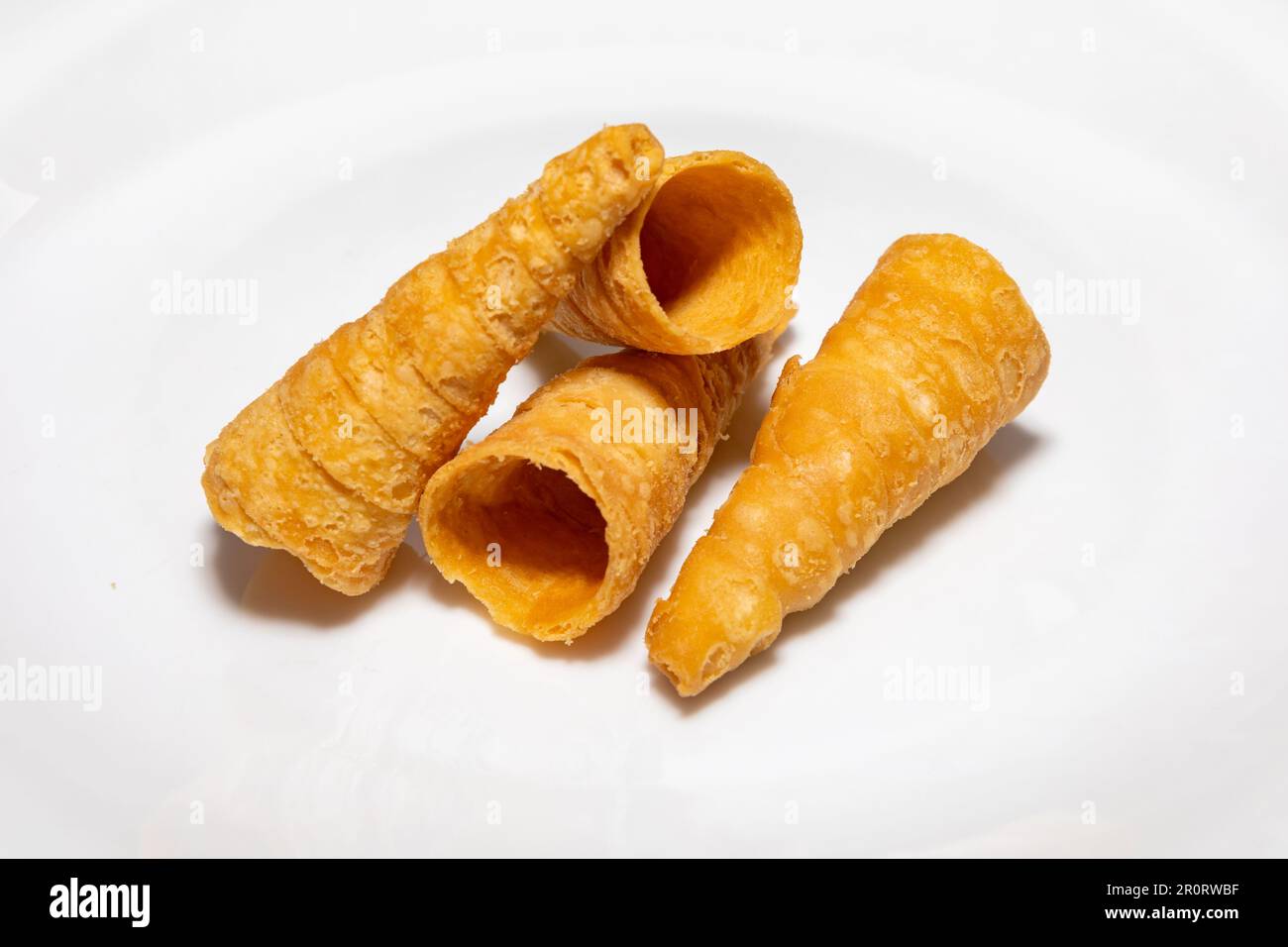 Traditional party snack known as 'canudinho'or 'tatu tail'. Stuffed with ground meat and traditional spices. Stock Photo