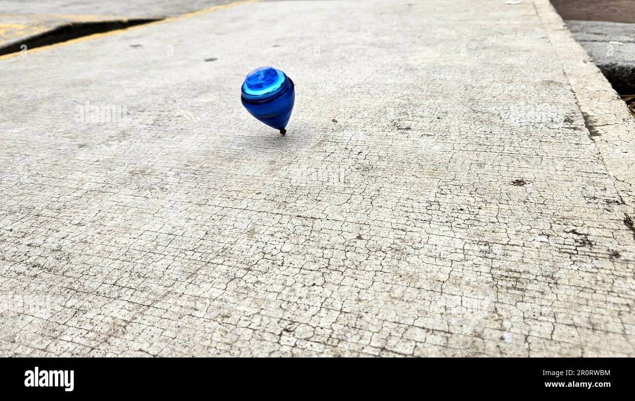 Blue spinning top, toy for children and adults, a type of spinning top