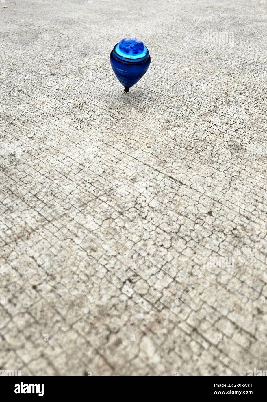 Blue spinning top, toy for children and adults, a type of spinning top