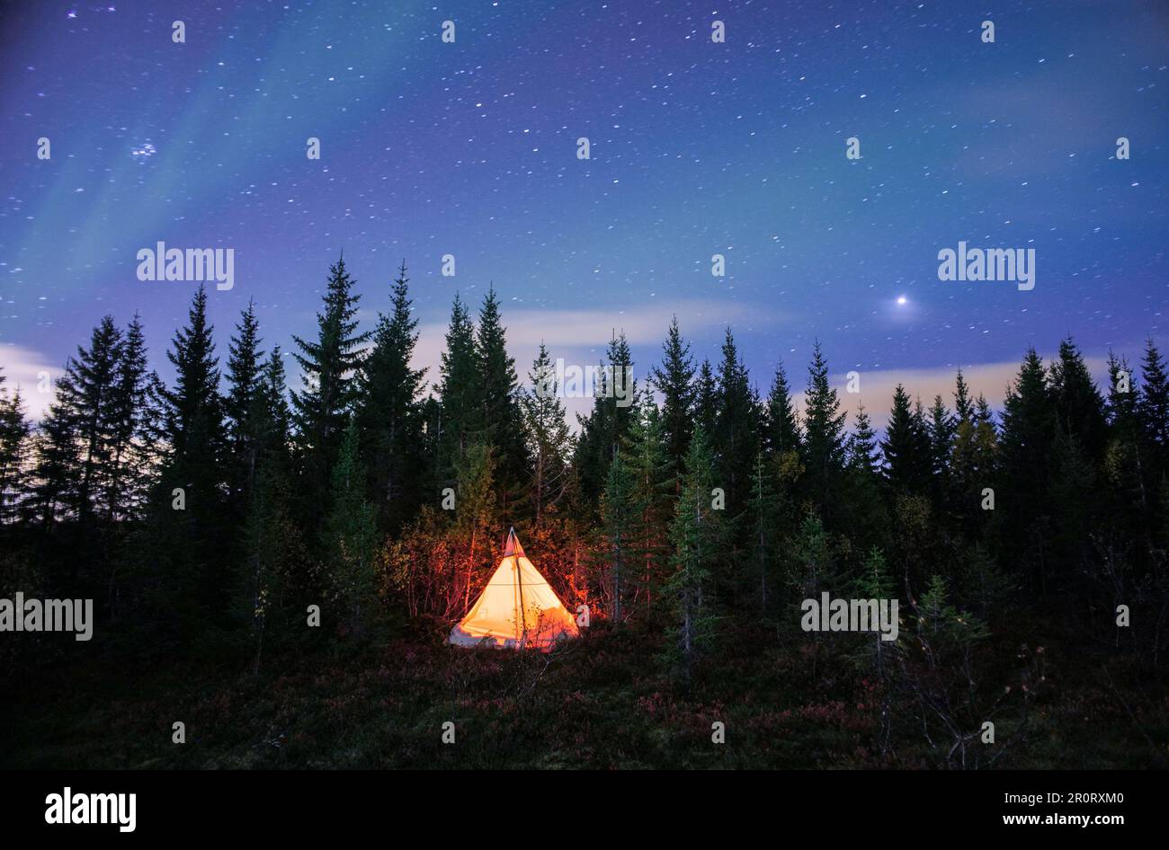 Glowing tent pitched under the clear night sky with stars Stock Photo ...