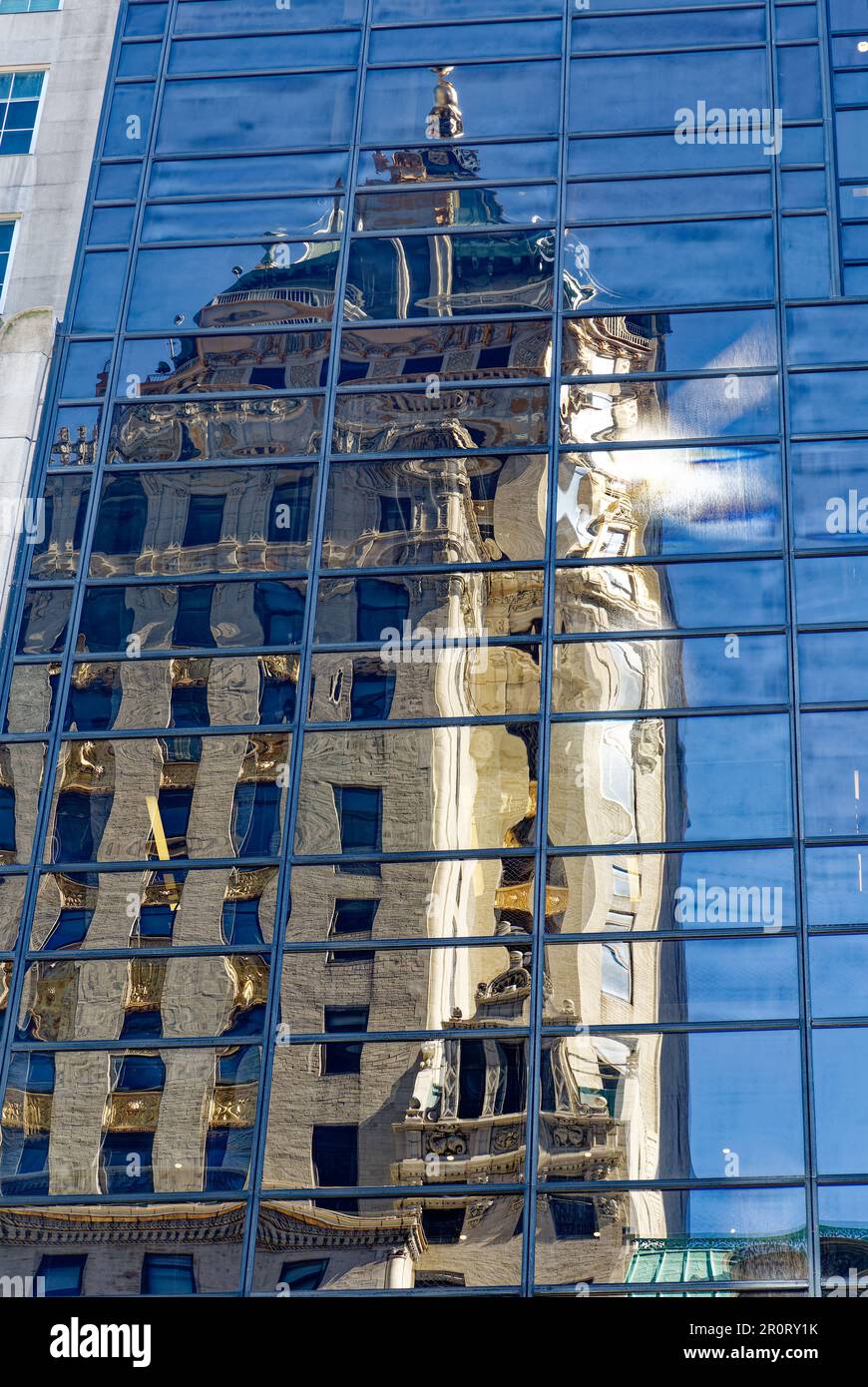 The Crown Building, reflected in Trump Tower on Fifth Avenue in Midtown Manhattan. Stock Photo