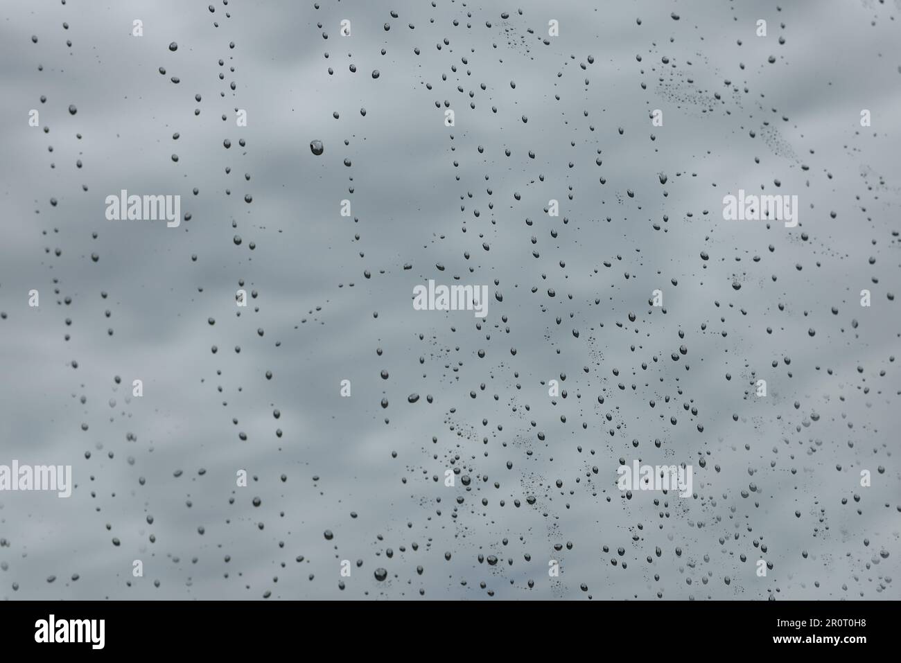 Drops of water on window glass as background, closeup Stock Photo