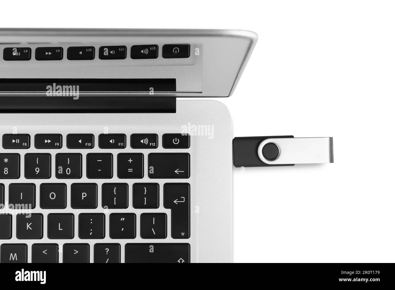 Usb Drive Top View Modern usb flash drive attached into laptop on white background, top ...