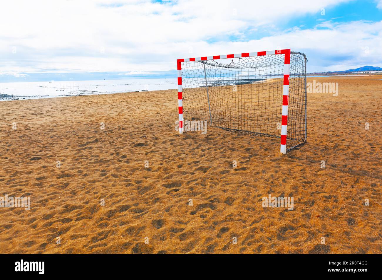 Sandy beach with soccer field . Goal post on the coast Stock Photo Alamy