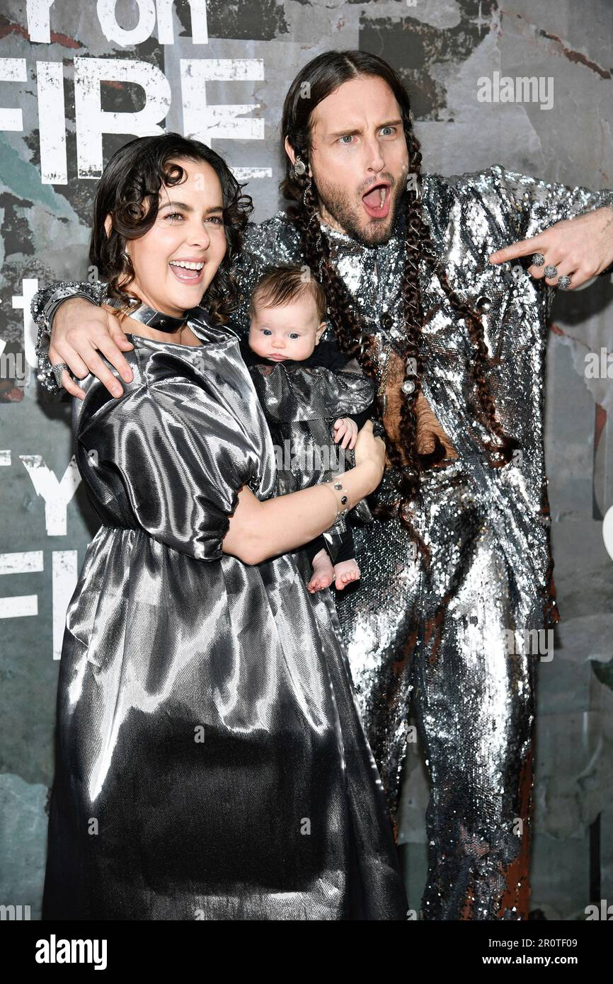 Nico Tortorella, right, poses with wife Bethany C. Meyers and daughter at a  special screening of the Apple TV+ drama City on Fire at Alamo Drafthouse  Cinema Downtown Brooklyn on Tuesday, May