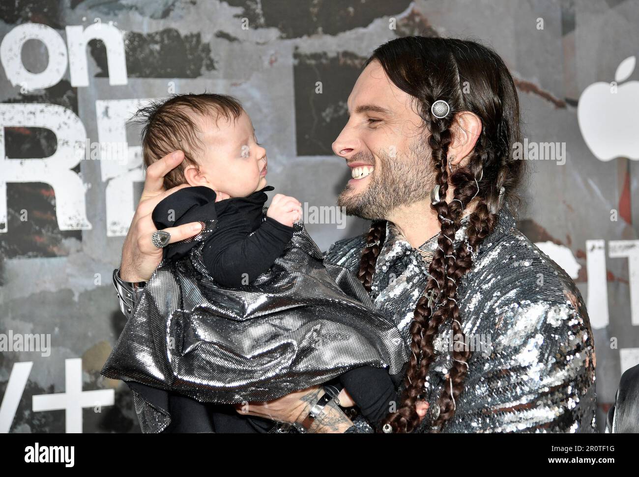 Nico Tortorella, right, poses with wife Bethany C. Meyers and daughter at a  special screening of the Apple TV+ drama City on Fire at Alamo Drafthouse  Cinema Downtown Brooklyn on Tuesday, May