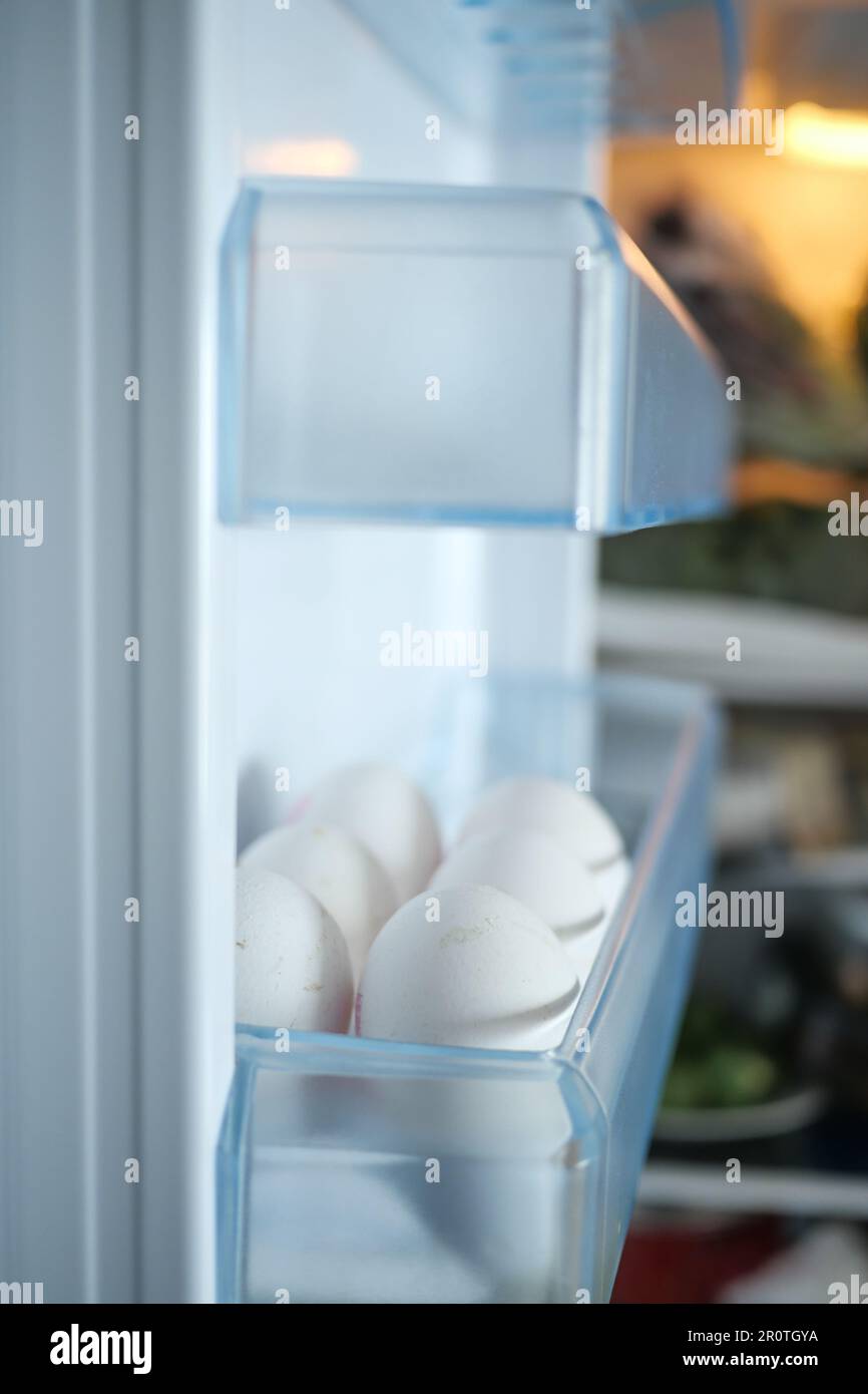 white eggs on the refrigerator shelf Stock Photo Alamy