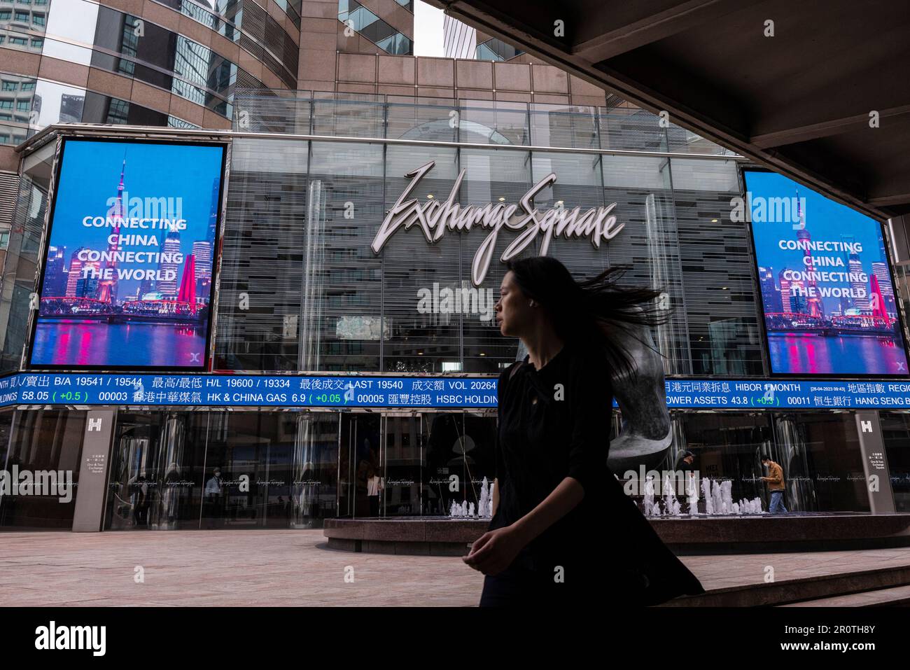 FILE - A pedestrian passes by the Hong Kong Stock Exchange electronic  screen in Hong Kong, April 26, 2023. Asian shares declined in muted trading  Wednesday, May 10, 2023 as investors awaited