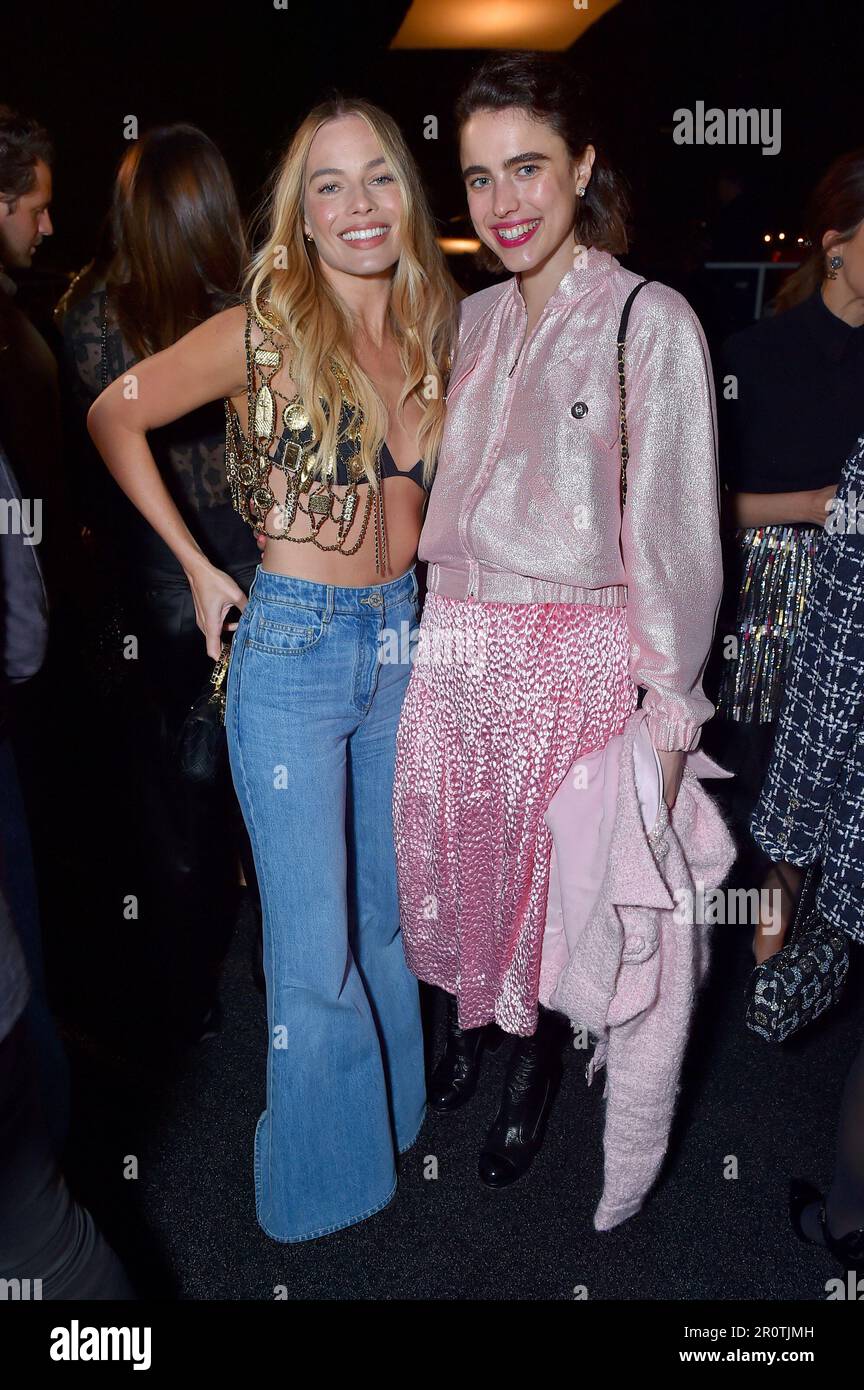 Margot Robbie, left, and Margaret Qualley attend the Chanel Cruise 2023
