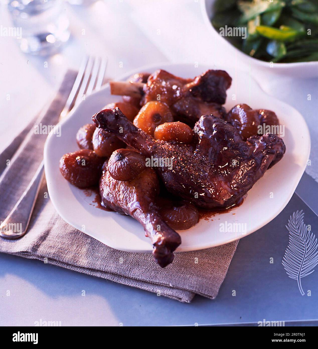 Duck legs confit with red wine and caramelized turnips Stock Photo - Alamy