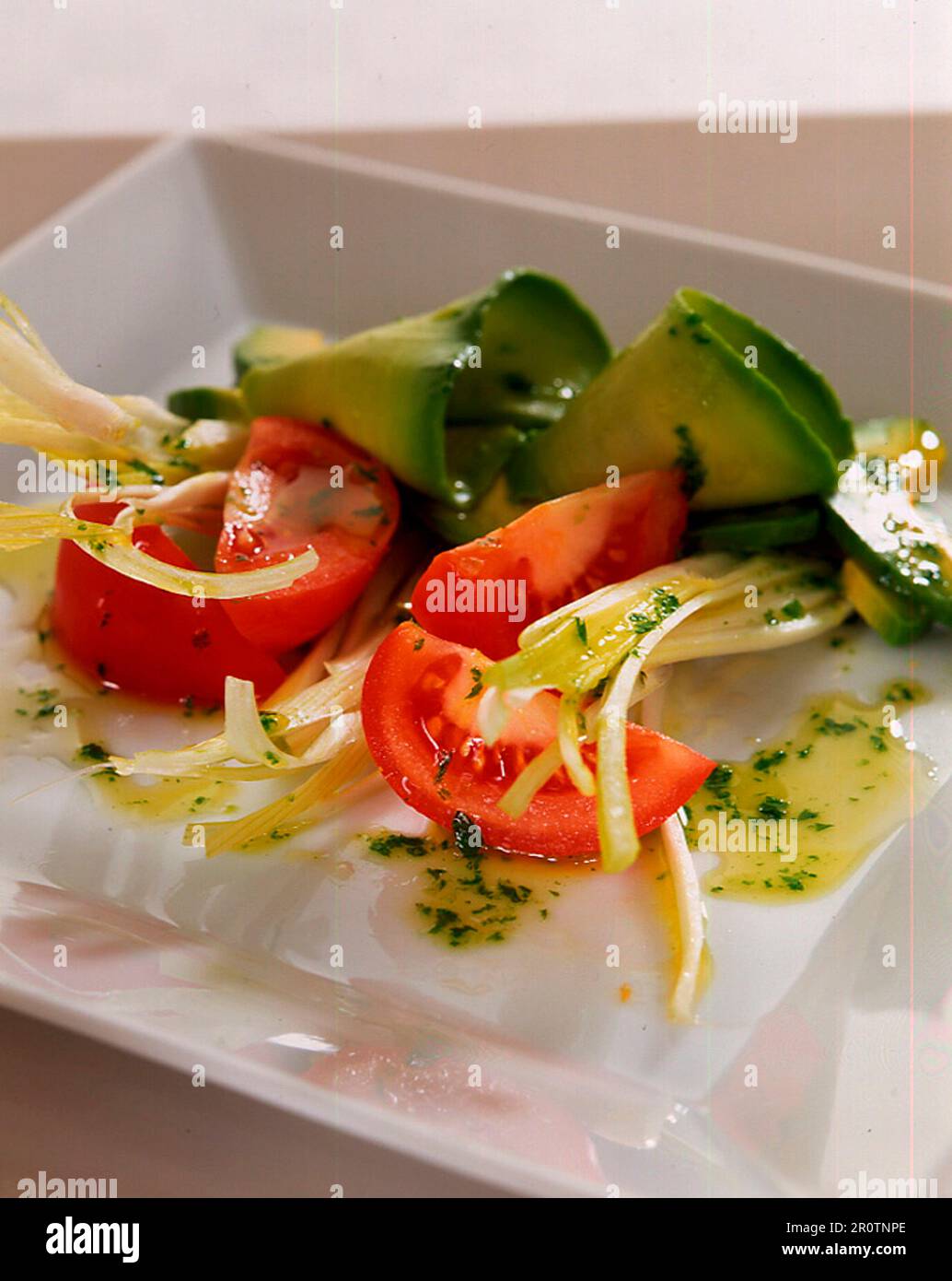 Tomato, avocado and onion salad Stock Photo - Alamy