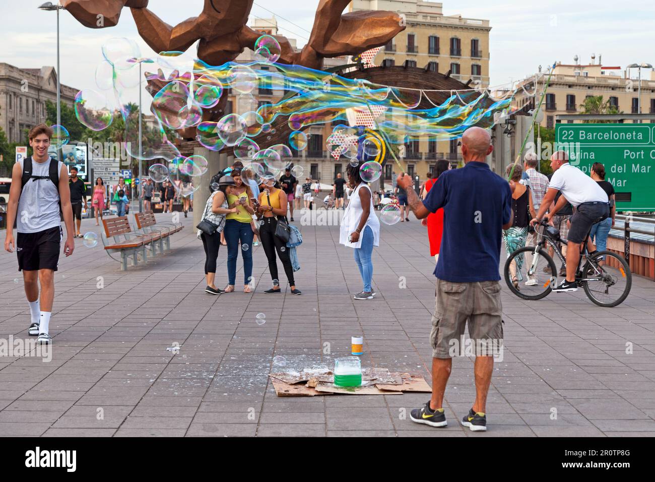 Barcelona, Spain - June 08 2018: Man making soap bubbles near the marina. Stock Photo