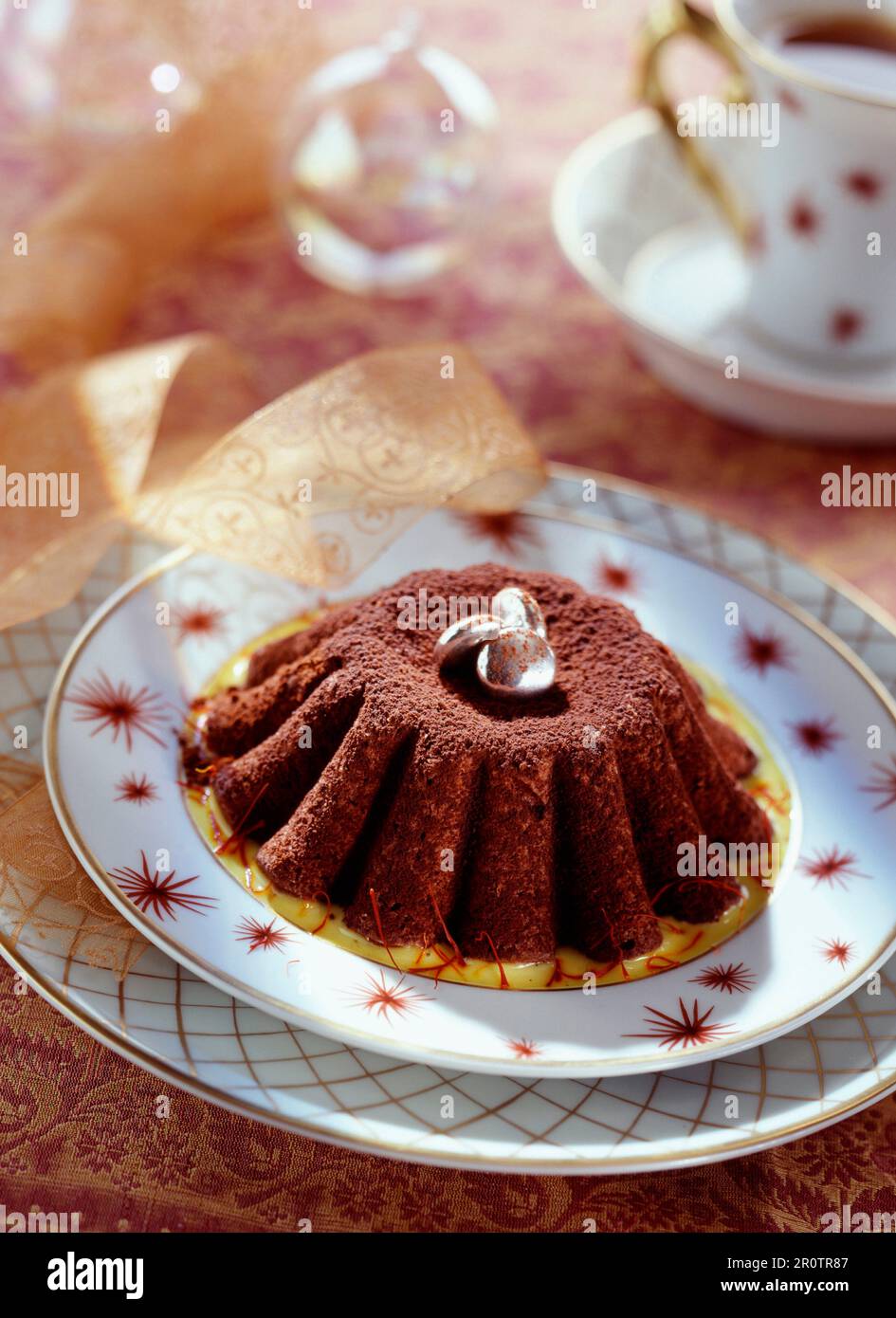 moist chocolate cake with saffron sauce Stock Photo Alamy