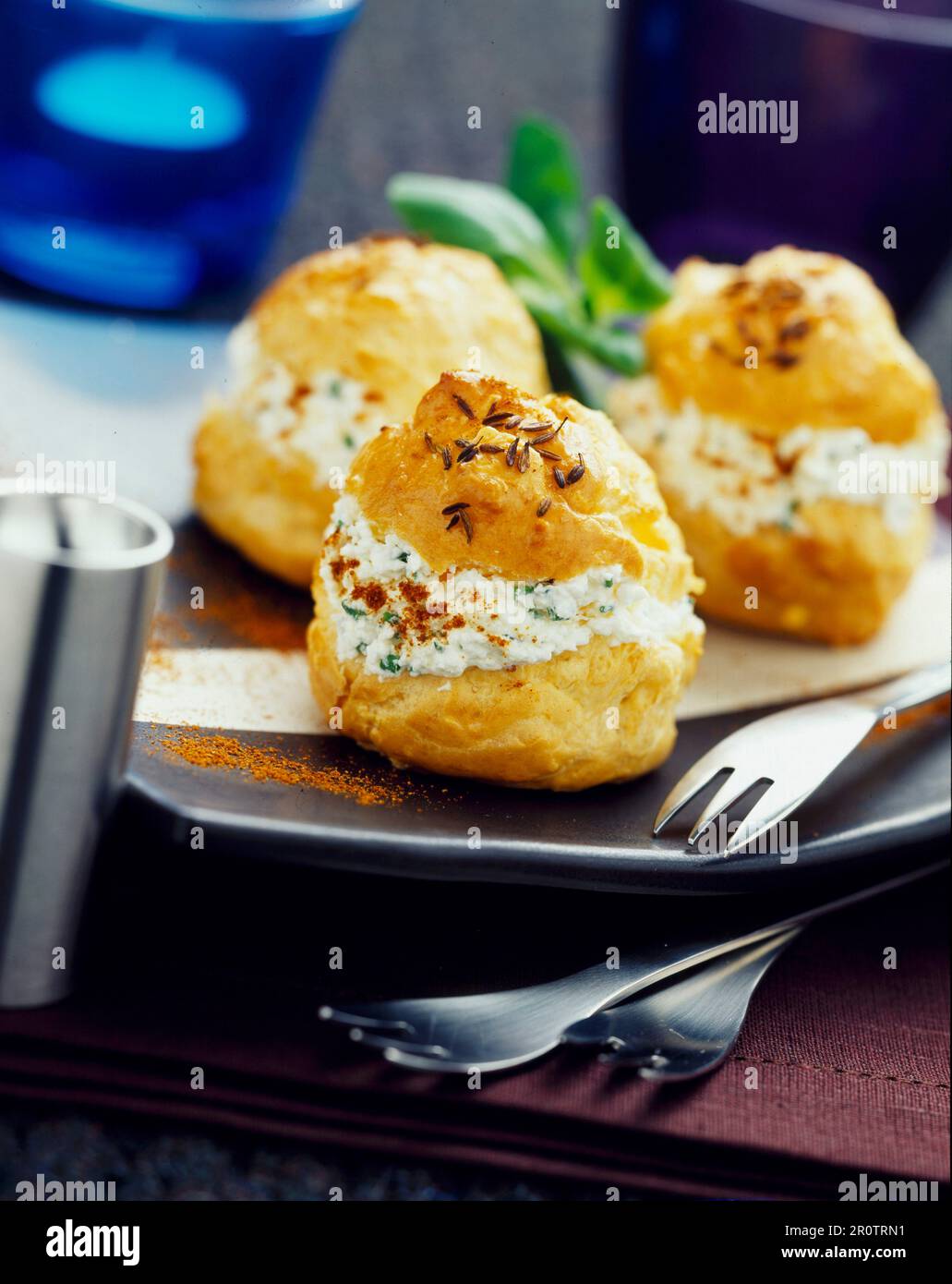 caraway puffs filled with paprika cream Stock Photo