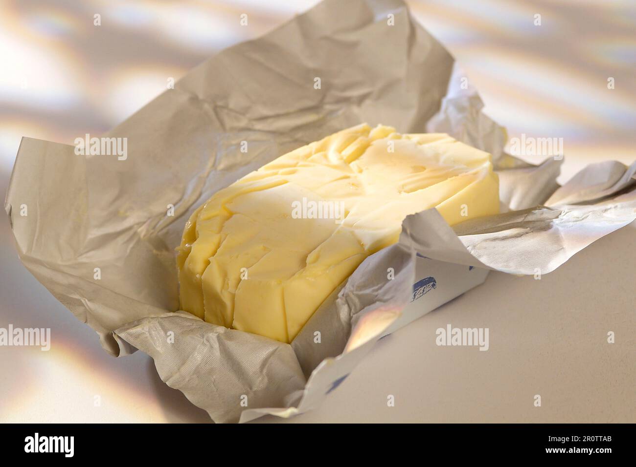 Open pat of butter Stock Photo Alamy