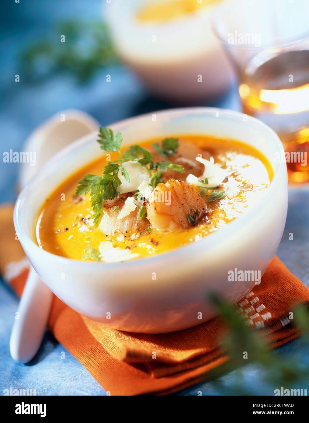 creamed pumpkin soup with scallops Stock Photo