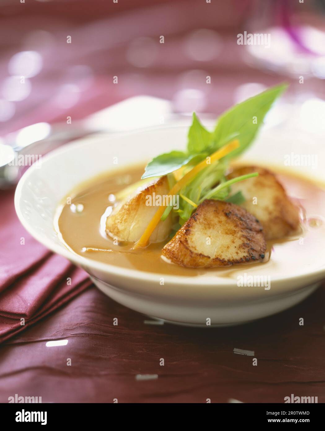 Pan-fried scallops in stock Stock Photo