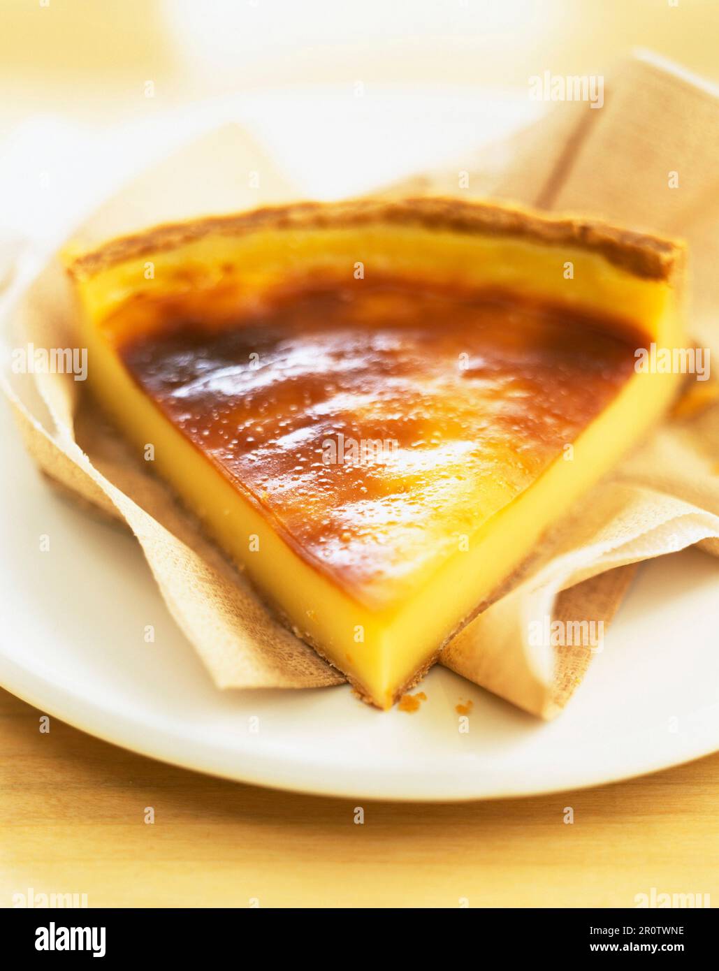 Slice of egg custard tart Stock Photo - Alamy