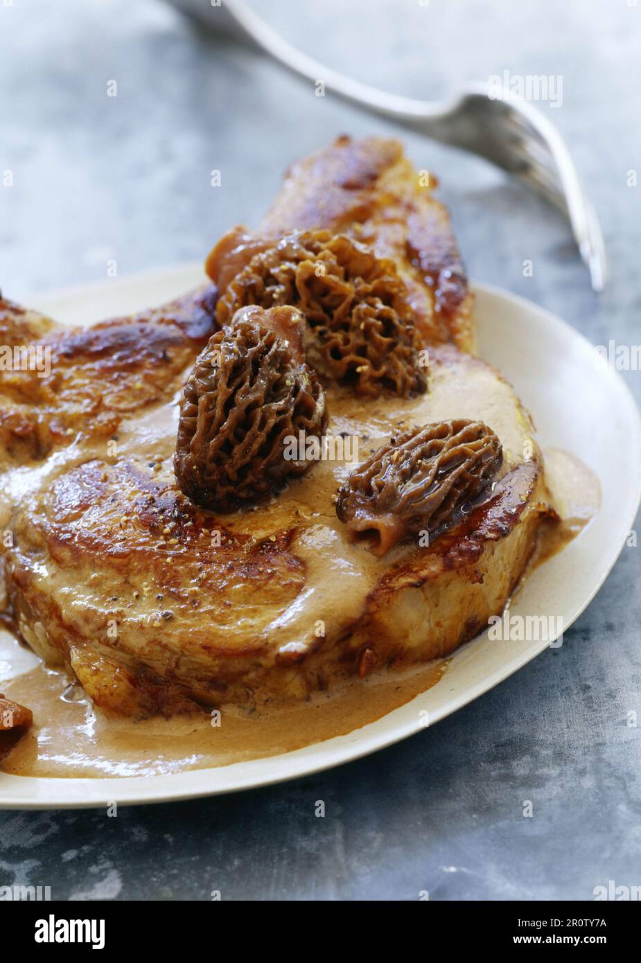 Veal chop with morels Stock Photo