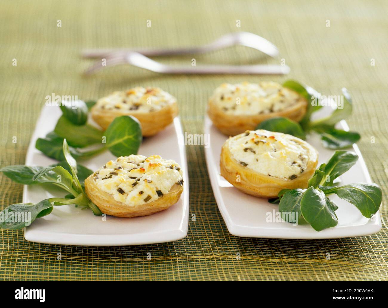 Artichoke bases grilled with goat's cheese Stock Photo Alamy