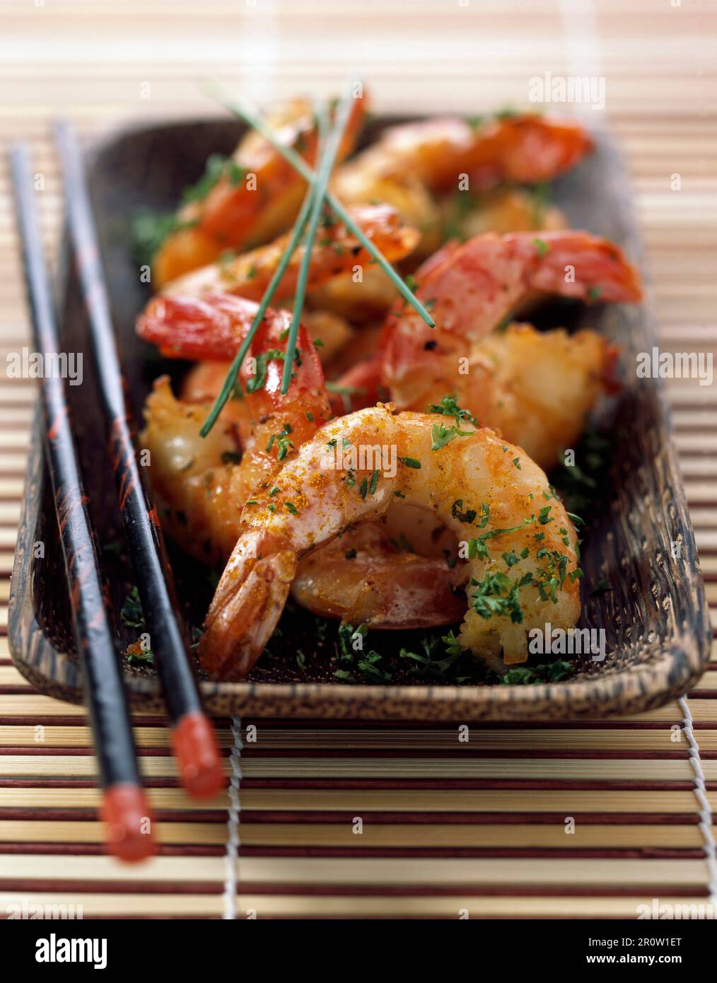 Pan-fried gambas with curry Stock Photo