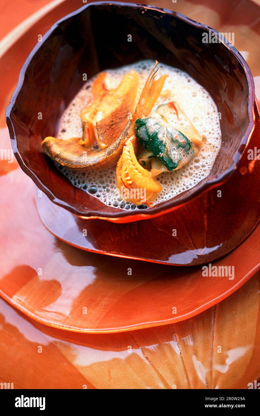 Peach soup with saffron and fresh water fish (bass, char, trout