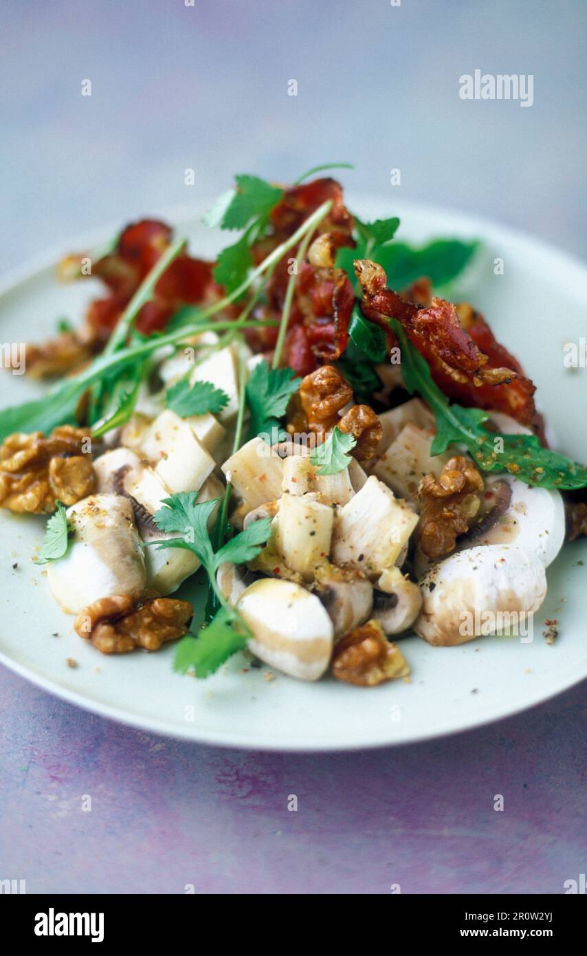 Steamed vegetables with walnuts and bacon Stock Photo