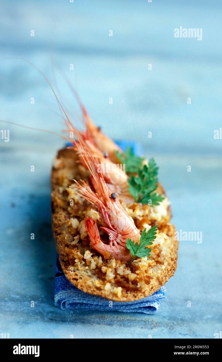 Crostino with shrimps and bottarga Stock Photo