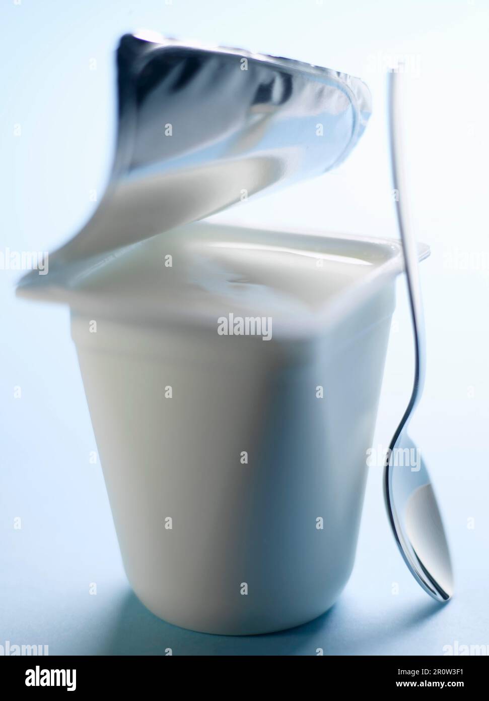 Open pot of yoghurt Stock Photo Alamy