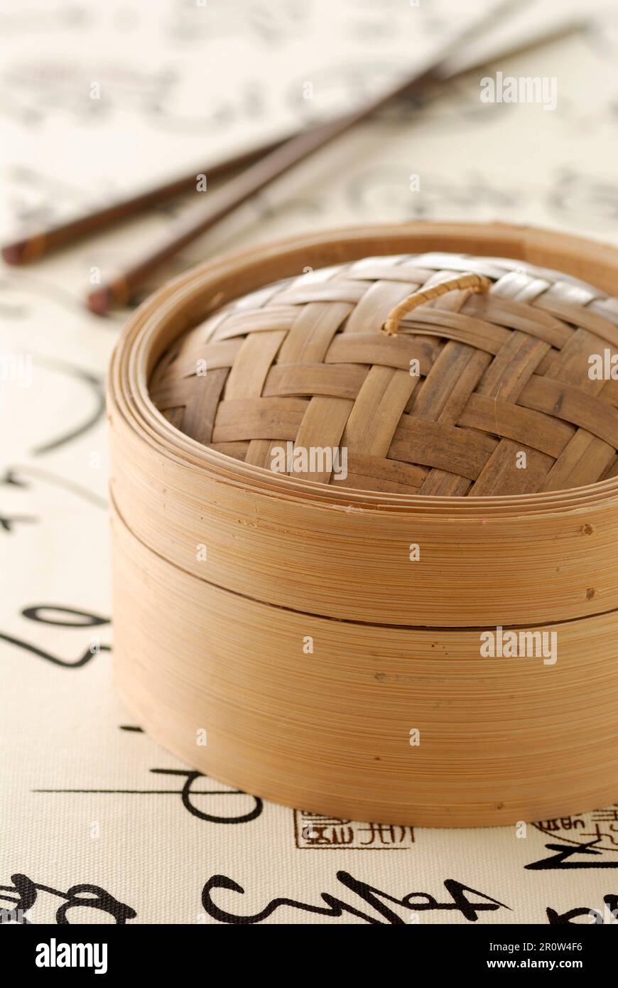 Chinese steam basket and chopsticks Stock Photo