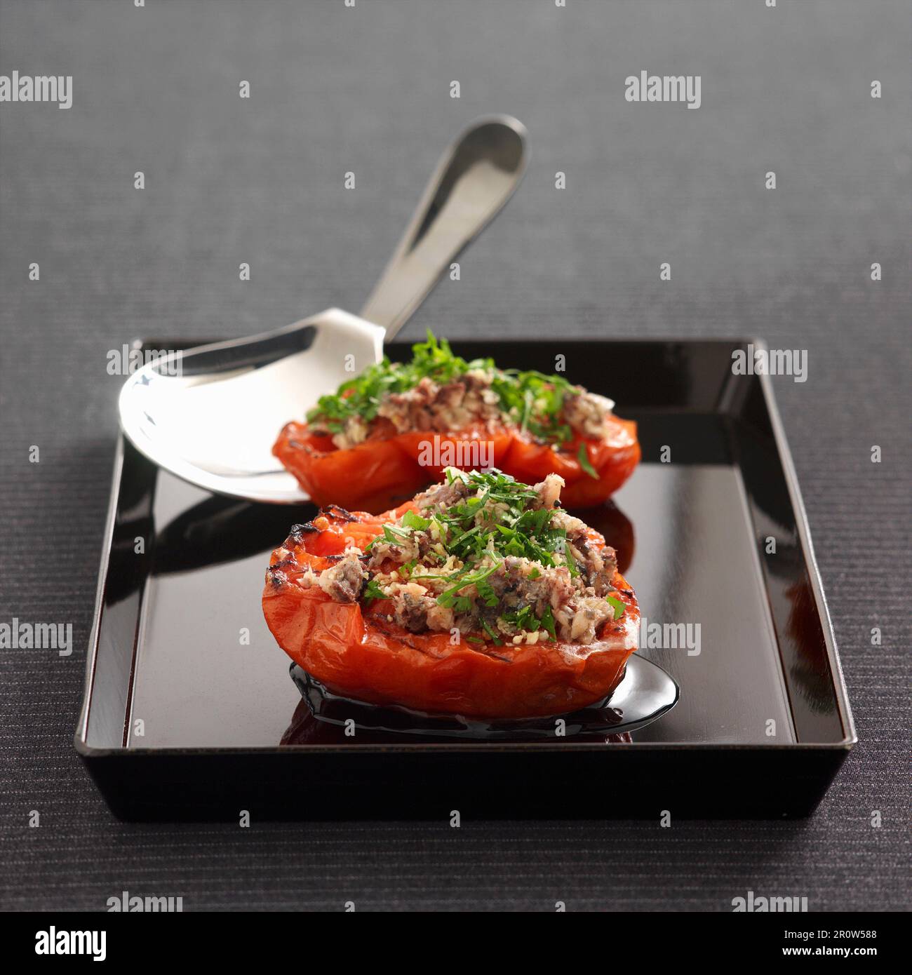 Provençal-style tomatoes stuffed with anchoyade Stock Photo
