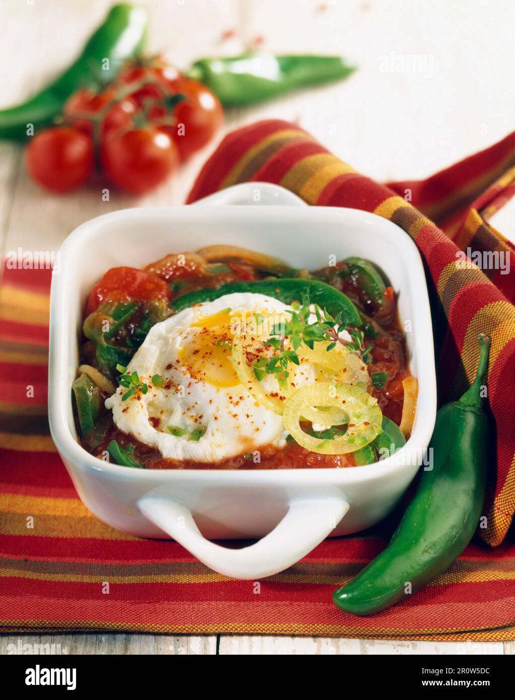 Piperade with fried eggs Stock Photo