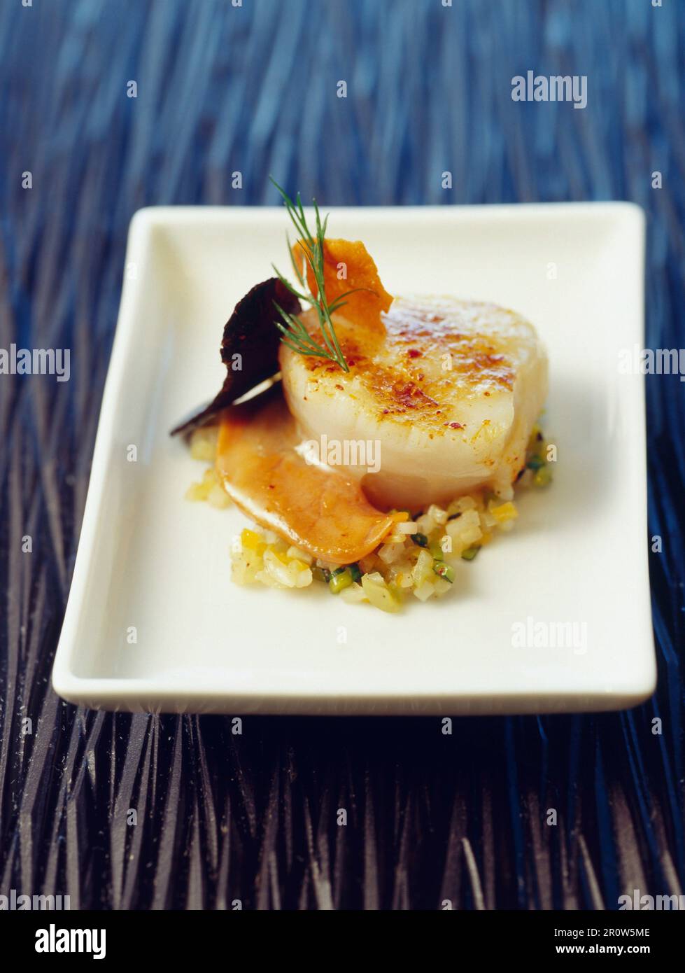 Pan-fried spicy scallop and finely diced vegetables Stock Photo - Alamy