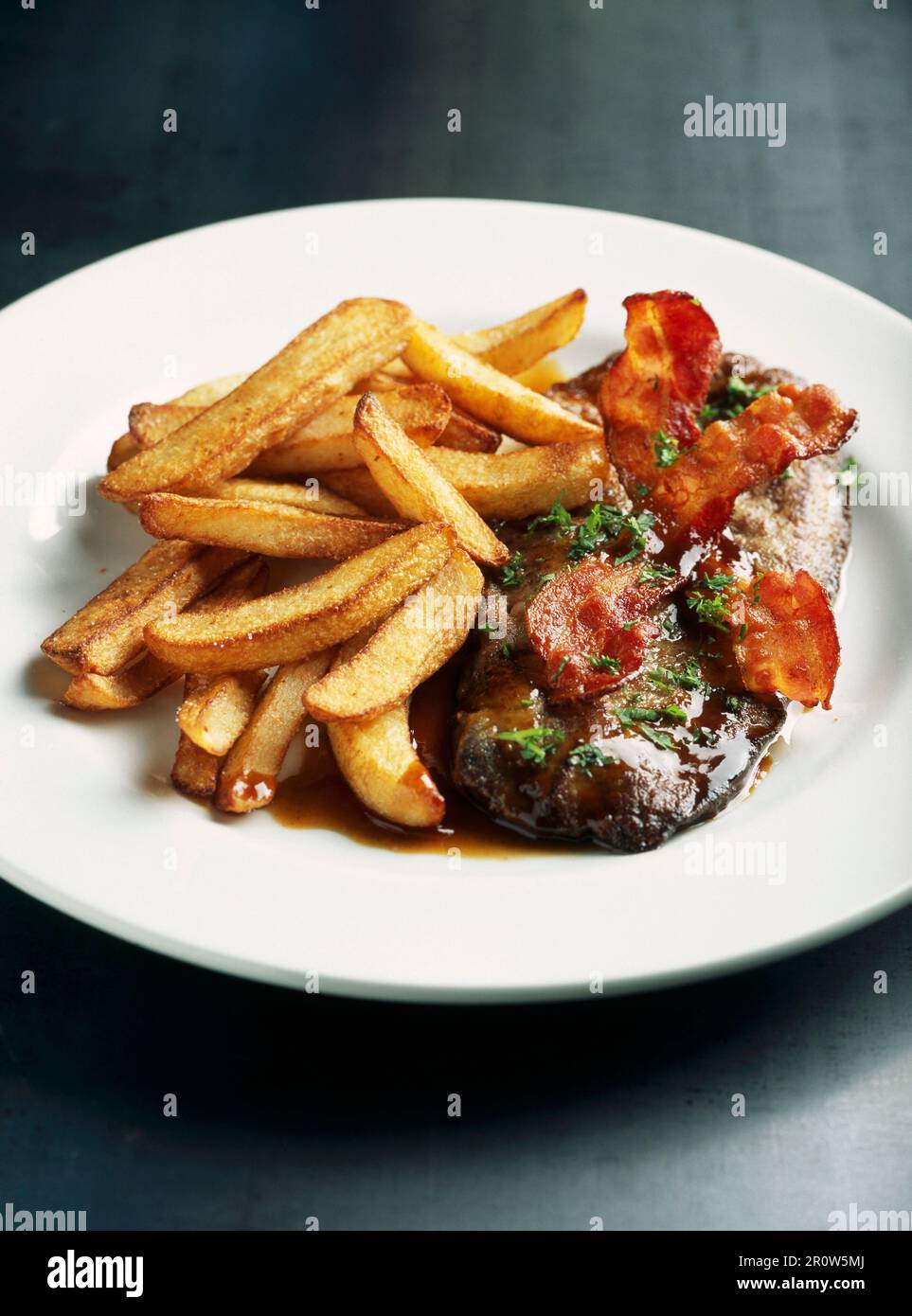 Panfried veal's liver with bacon and fried potatoes Stock Photo Alamy