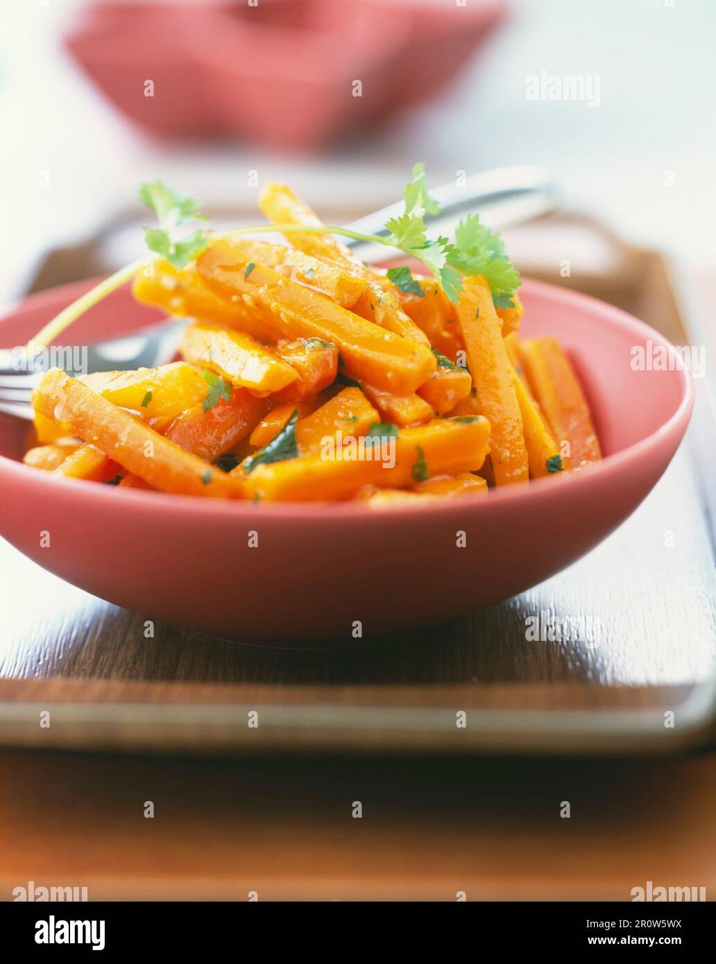 Glazed carrots with coriander Stock Photo - Alamy