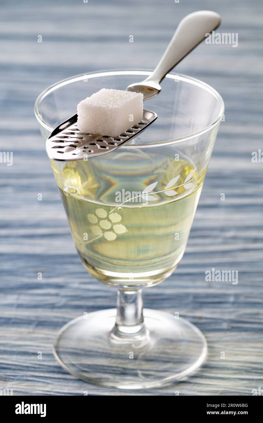 Glass of Absinthe,spoon and sugar lump Stock Photo