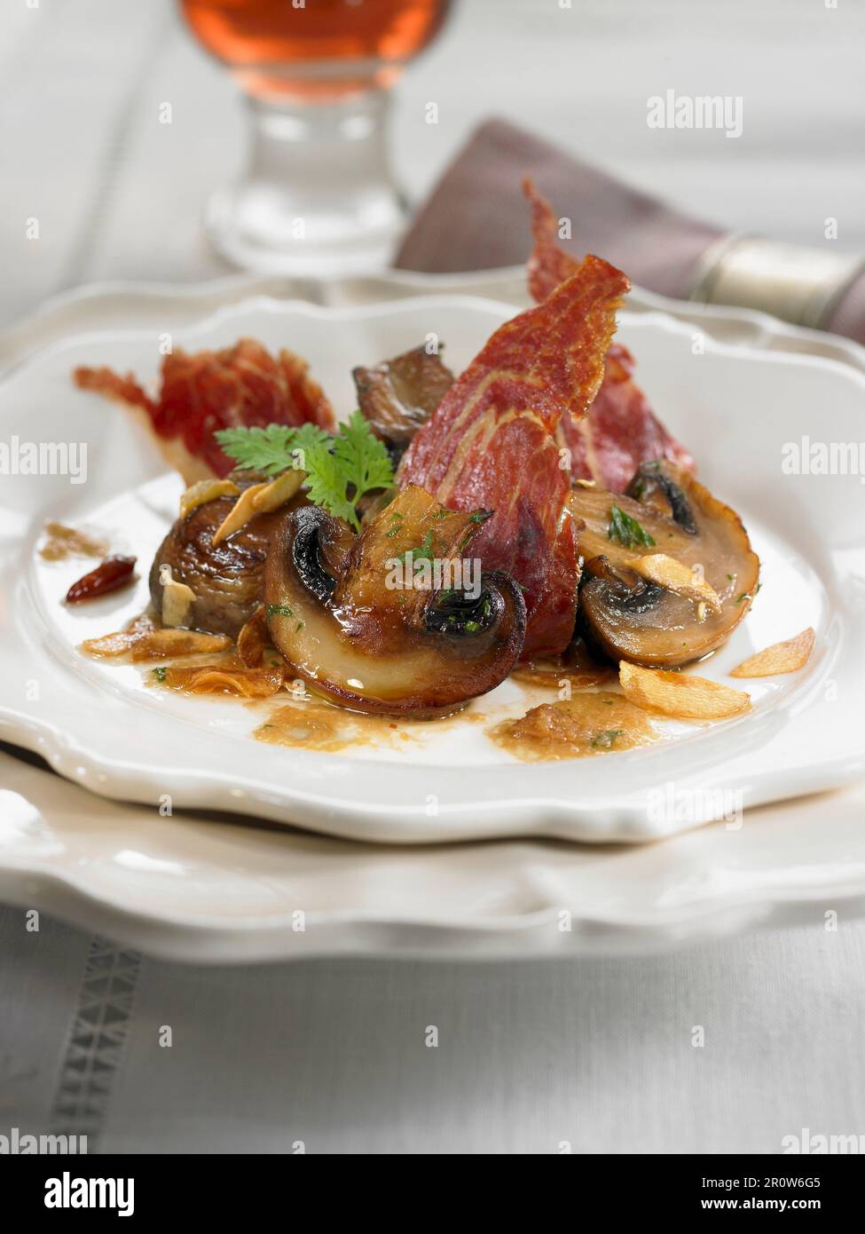 Button mushrooms with spanish ham Stock Photo - Alamy