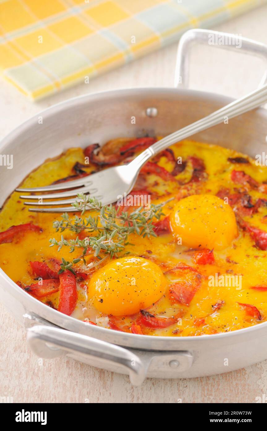 Baked eggs with tuna Stock Photo