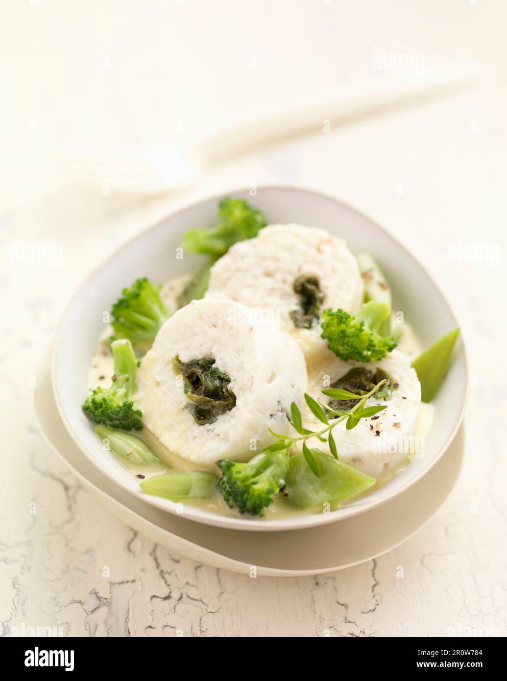 Fish sausage with green vegetables Stock Photo