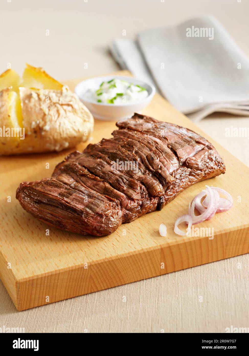 Grilled sirloin steak with a baked potato Stock Photo Alamy